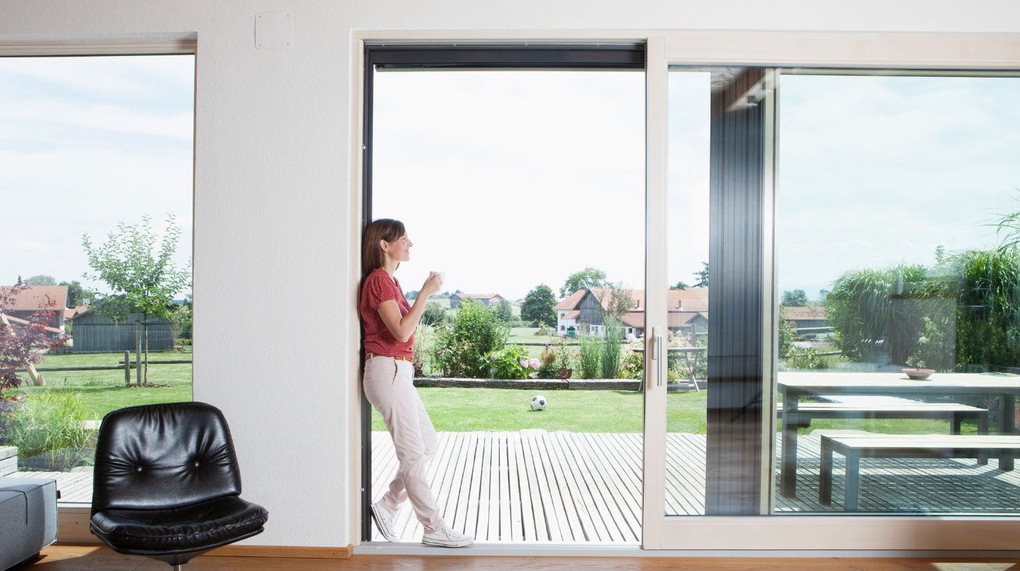 White sliding doors leading to a patio White sliding doors leading to a patio